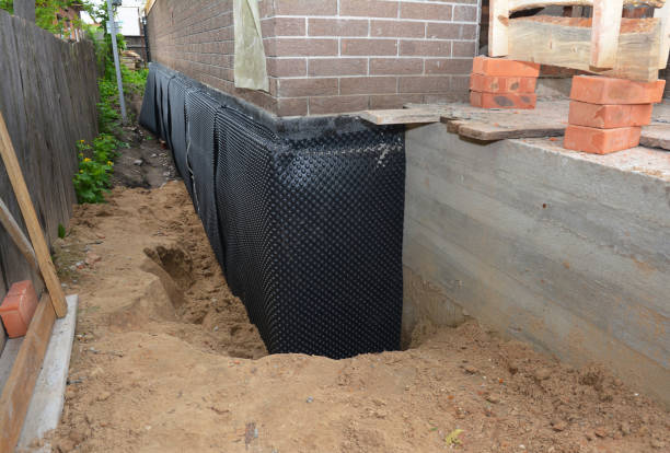 Happy homeowners after waterproofing job in Castalia